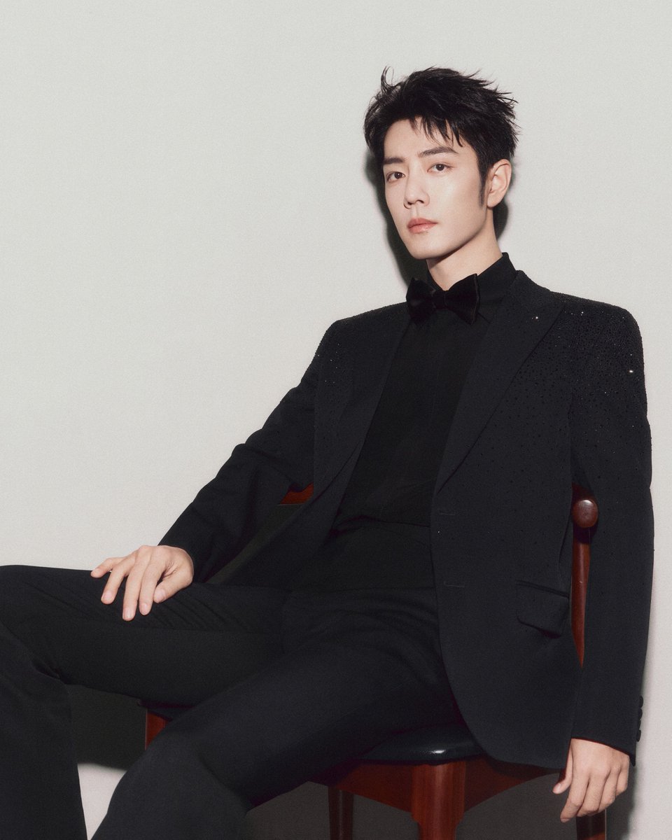 gucci's tweet photo. Global Brand Ambassador #XiaoZhan, who stars in the House’s #YearOfTheSnake campaign, is captured moments before #WeiboNight. For the special evening, the actor and singer wore a wool suit with gradient crystals by Creative Director Sabato De Sarno. https://t.co/u7vFkMkBYe