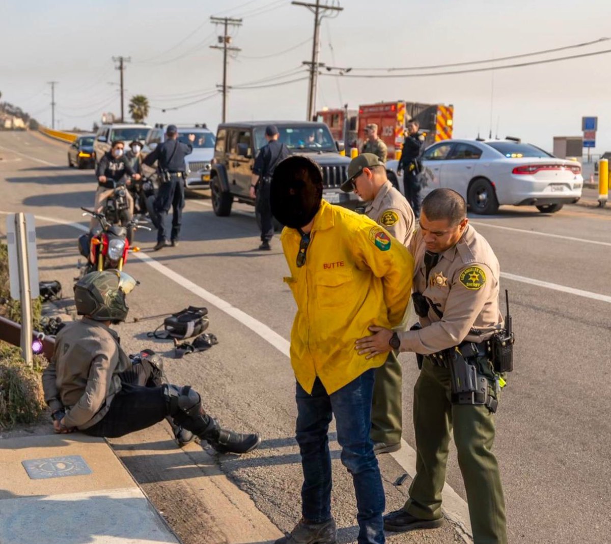 JUST IN: Photos reveal that at least two individuals were arrested for impersonating a firefighter during the Palisades Fire evacuation. The impersonator, identified as an illegal immigrant, was arrested alongside another person. This alarming incident highlights the urgent need
