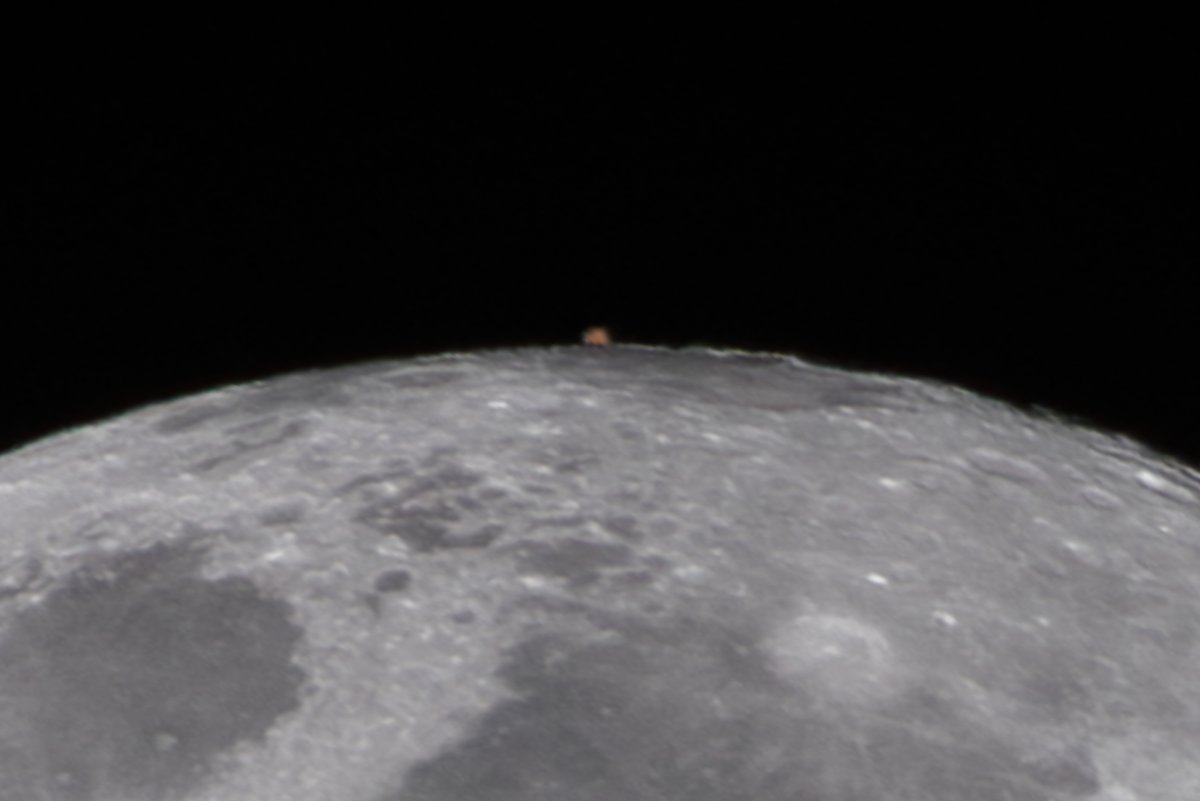 This is a view I've personally never captured before: Mars reappearing from behind the Moon. It's a handheld telephoto (600mm) shot and cropped like crazy, but still it is what it is. So cool!