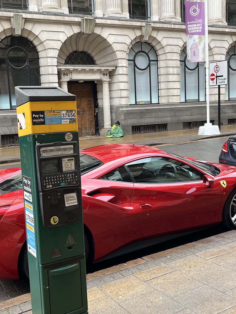 DeanofBrum's tweet photo. Coming out from lunch and saw this.Fair reflection of our society? Ferrari and poor Lazarus. https://t.co/DPqPFeB0Lw