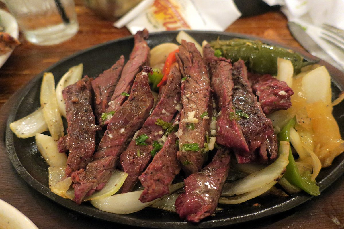 TracesofTexas's tweet photo. Was  there life before fajitas? I THINK there was. At least I seem to  remember a cold, dark time that lasted an eternity and I guess all of  that would be considered "B.F." (before fajitas) time. I'll bet you  didn't know that fajitas were originally introduced at Ninfa's in  Houston on July 13, 1973, as tacos al carbon. You do now!

Photo of Ninfa's fajitas taken by Wally Gobetz.