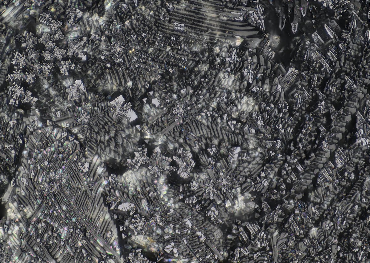 Here’s two super duper close ups of a larger mm I pulled out randomly to image. There are a couple spots that look foggy and yellow, this is the light passing through the glass, and in one spot you can see a beautiful iridescent rainbow.