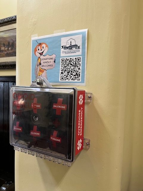 The naloxone distribution box in the Old Administration Building. Grab a kit, save a life. An overdose can happen anywhere. #naloxone #harmreduction #savealife #TewksburyMA