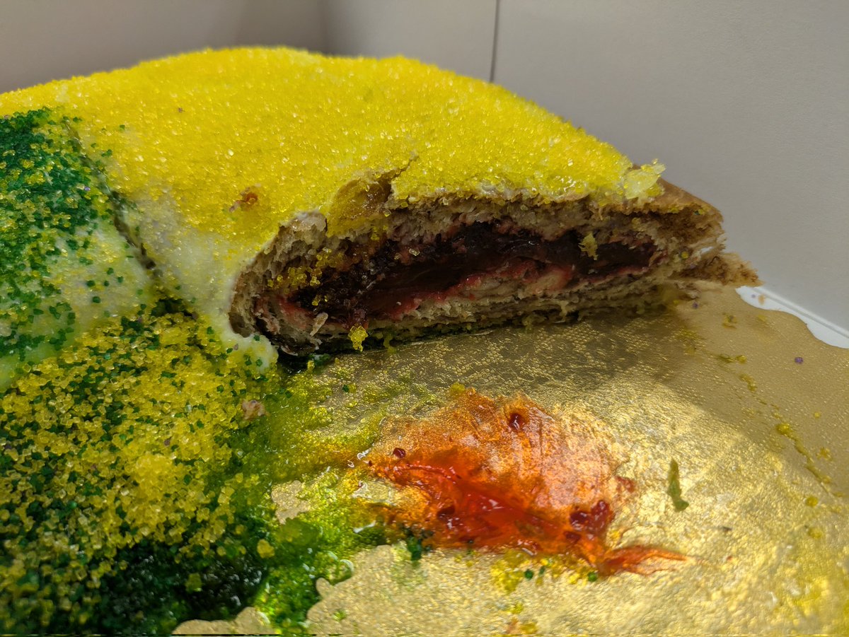 Matherne's raspberry filled #kingcake. Very thin bread, high gloop factor. Filling reminiscent of a very tangy jelly donut, crunchy sugar over the icing.