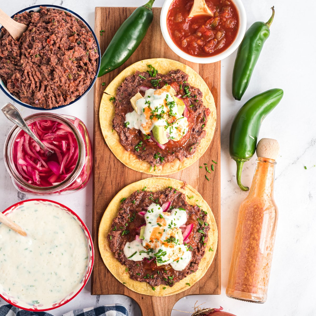 AFoodRevolution's tweet photo. Plant-based, black bean street tacos? Yes, please! 
Street tacos are a central component of Mexican culture and are called antojitos, meaning “little cravings.” They’re meant to be enjoyed while walking about, as a small snack
.🌮 Get the recipe here: https://t.co/oErzjk8jEG https://t.co/5rABJHjpXv
