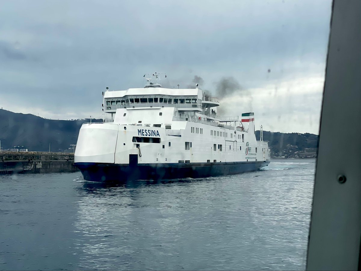 AndreasWiede's tweet photo. Crossing the Strait of Messina 🇮🇹, from #Calabria to #Sicily on a fast passenger craft. This takes 15 minutes and we pass the train ferry “Messina” as we leave Villa San Giovanni: this is a vessel usually  transporting the Rome to Sicily #InterCity and #InterCityNotte carriages. https://t.co/gJsHyFkdD1