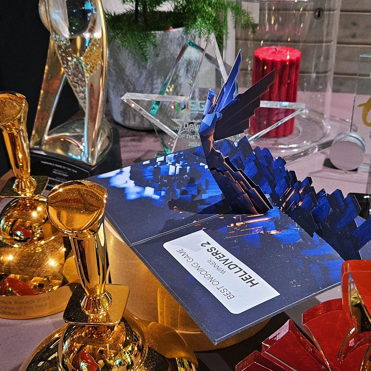 Almost a week back at work after celebrating holidays with family and friends. Last year was absolutely epic and overwhelming with the amazing journey of #helldivers2 ! Pic 1: Sporting our neat new <a href="/helldivers2/">HELLDIVERS™ 2</a> Christmas sweaters! Pic 2: Collection of trophies growing 👀