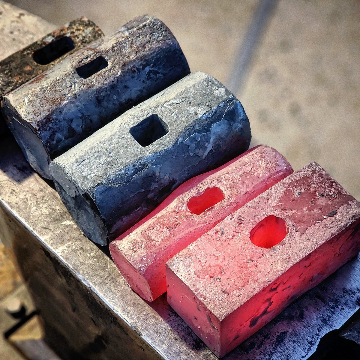 Awesome day in the workshop using the new #treadlehammer.  5 hammer eyes punched and roughed out. 4 hammers will be made with 1045 steel. One hammer is 4140 steel! Forge Ahead!!! ⚒️🔥⚒️

#blacksmith_edc 
#blacksmith 
#hammer
#gotmetal
#1045steel 
#4140steel