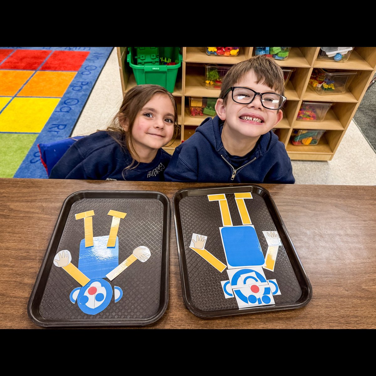 Pre-K students are learning about straight and curved lines with Mat Man.