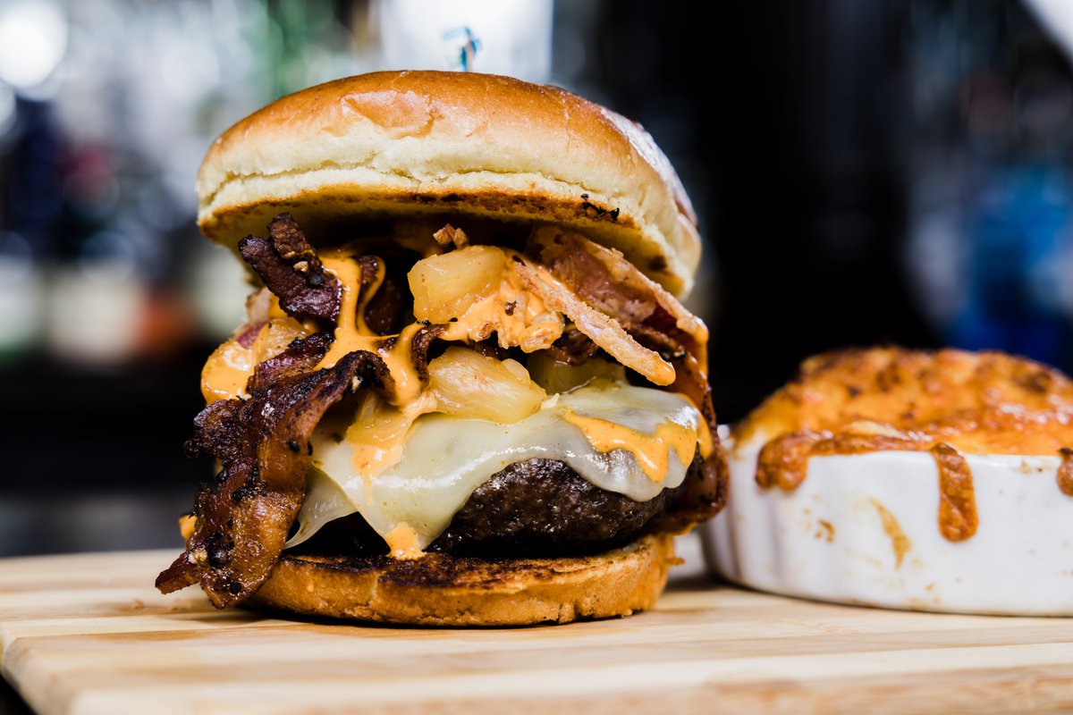 Looking to warm up this winter? Our #VolcanoBurger will definitely do the trick. Made with our house-made pineapple-jalapeno jam, peppercorn bacon, pepper jack cheese, fried onion strings, and creamy sriracha sauce, it might make you feel like you're relaxing on the Big Island.