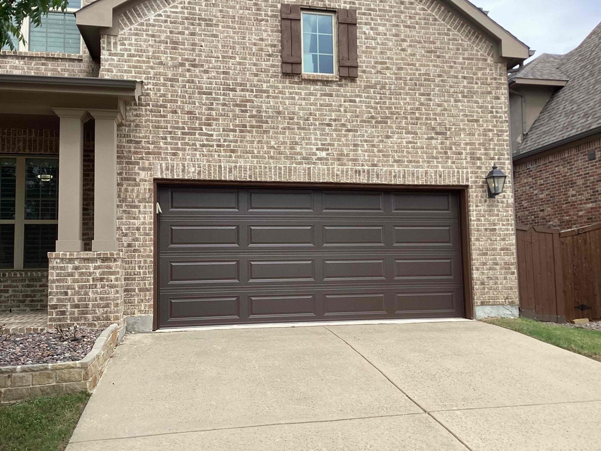 PlanoOverhead's tweet photo. Transform your home's curb appeal with a classic touch! We’re excited to showcase our installation of a beautiful brown Long Raised Panel garage door. This stunning addition not only enhances the aesthetic of the property but also provides durability and security. Ready to ele... https://t.co/mFn8FkxAfp