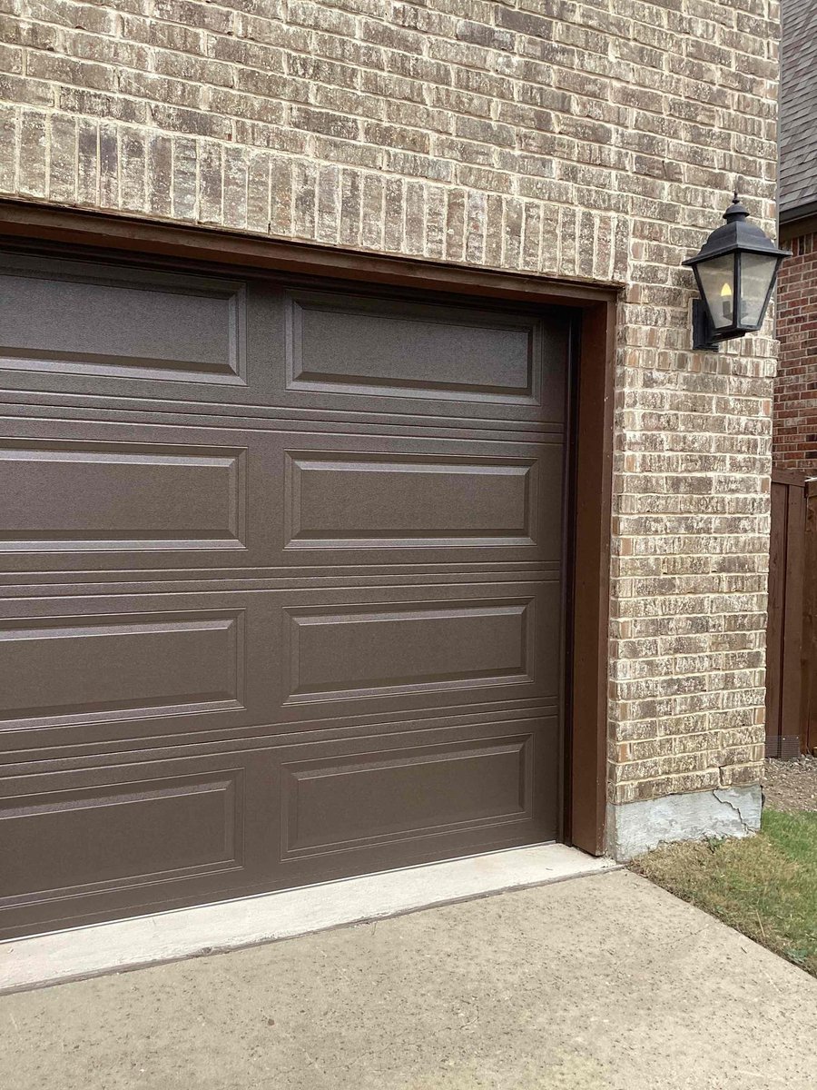 PlanoOverhead's tweet photo. Transform your home's curb appeal with a classic touch! We’re excited to showcase our installation of a beautiful brown Long Raised Panel garage door. This stunning addition not only enhances the aesthetic of the property but also provides durability and security. Ready to ele... https://t.co/mFn8FkxAfp