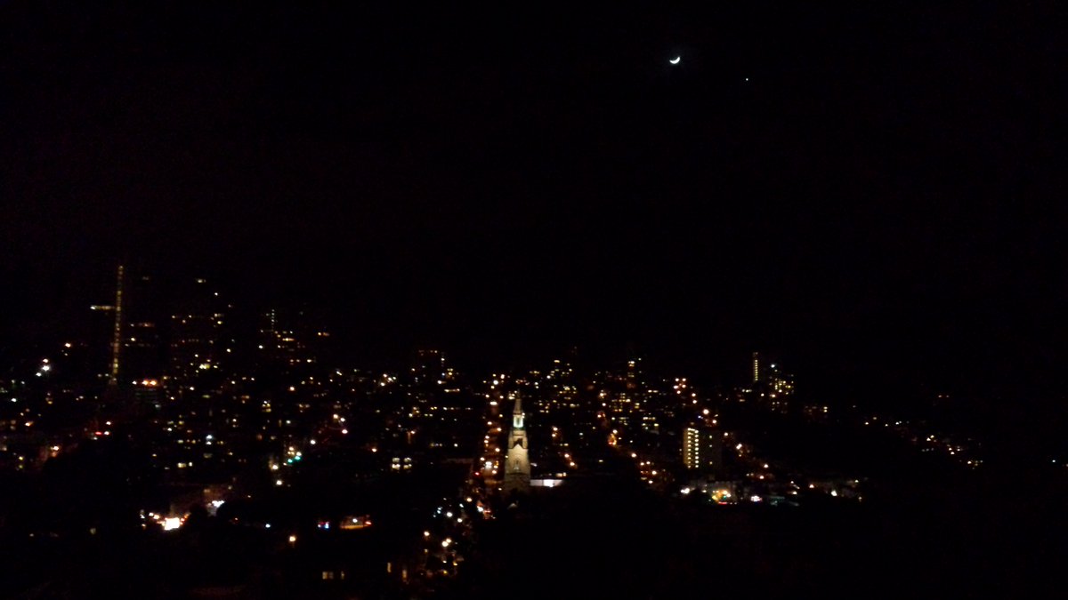 FototakerTony's tweet photo. NOT recent by any means, but a handheld night scene of my #CitybytheBay with the #crescentMoon above! This is from 2015. In another year after snapping this picture, I'd be on the #EastCoast! @MoonHour321 #laLunaMia @MoonHourSocial #laLuna #myMoon #justLookUP #cellpix https://t.co/Mm02CBNnP8