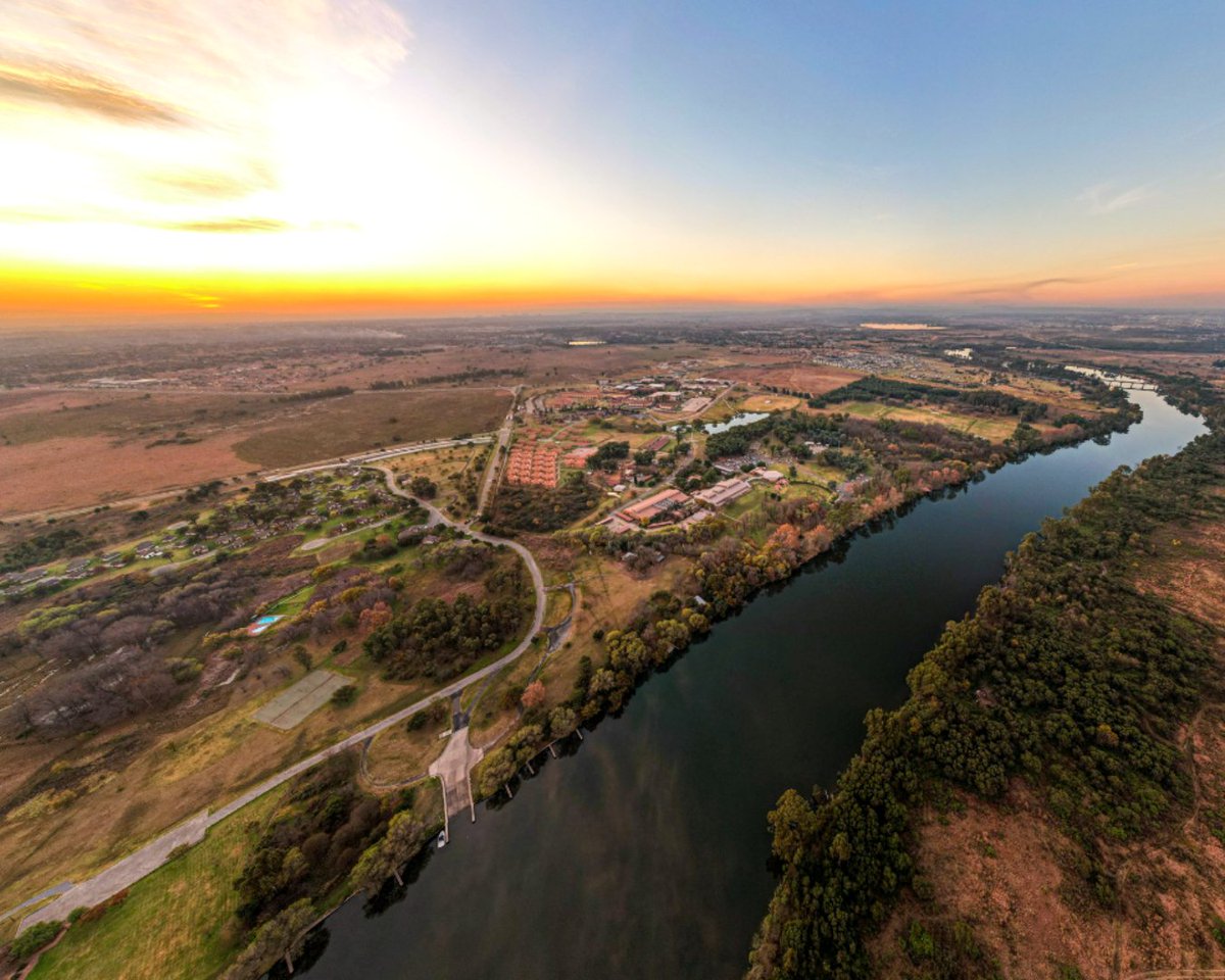theNWU's tweet photo. Discover NWU's stunning campuses through breathtaking drone shots of Mahikeng's Great Hall, Potchefstroom's Main Building, and Vanderbijlpark's riverside view. What do these landmarks mean to you? Share your #MyNWU story in the comments to inspire incoming #NWUEagles! https://t.co/IBLvcjtJZx
