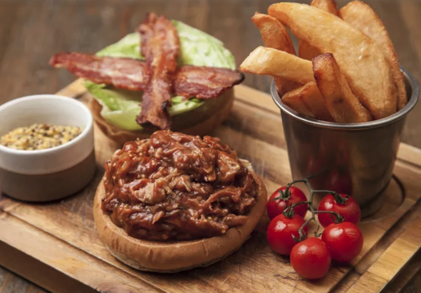 NCButchers's tweet photo. Not everyone’s calorie-counting in January, so don’t forget to keep crowd-pleasers on your menus🙌. This ultimate pulled pork bun with peak-season Bramley apples, crispy bacon and triple-cooked chips is sure to satisfy diners’ winter comfort cravings: https://t.co/gnMjZrGaIq https://t.co/930jNWWIm2