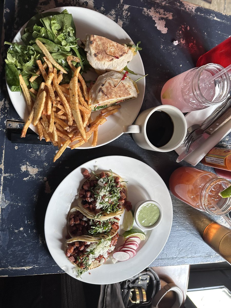 Jordan and faith share a platter of chorizo tacos,  breakfast sandwich on english muffin, and washing it down with michelada and spicy watermelon marg🩵🩵🩵