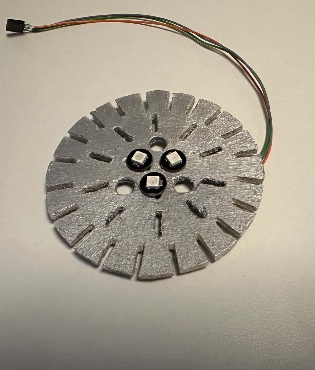 StarChopsticks's tweet photo. In preparation to the #Starship launch 7 I created the thrust section of my future Starship Booster model out of wood and soldered 33 addressable LEDs to it. A Python script brings the Raptors to life. It captures the live stream and controls the LEDs in real time via an ESP32 https://t.co/4yr1CS7jhG