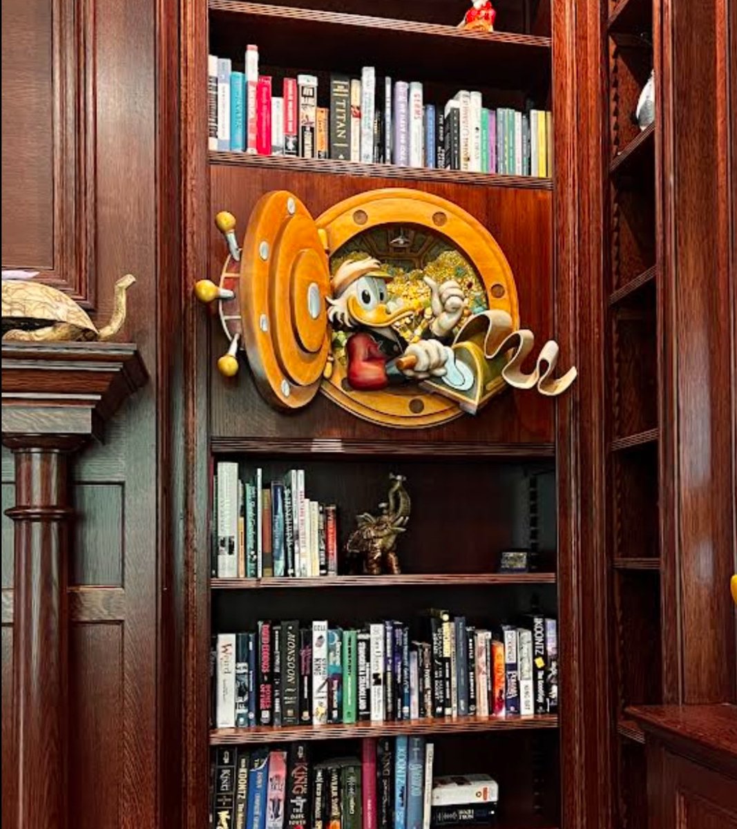 Raymond_Kinman's tweet photo. I was recently commissioned by a Disney collector to hand-carve this (very challenging!) Scrooge McDuck-themed faux wall safe from jelutong wood for their home office.
#DisneyArt #ScroogeMcDuck #HandCarved #WoodCarving #CustomArt #DisneyCollector #DisneyFandom https://t.co/4S9rKbwPFk