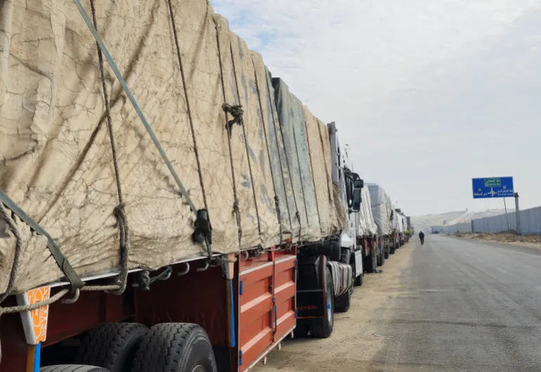 JessTimings's tweet photo. Trucks lining up, waiting for the Rafah crossing to reopen so they can get aid to people in Gaza.

Let this ceasefire come into effect. Let it be permanent.  

Credit: Reuters via Al Jazeera. https://t.co/gS4vF9tPf7