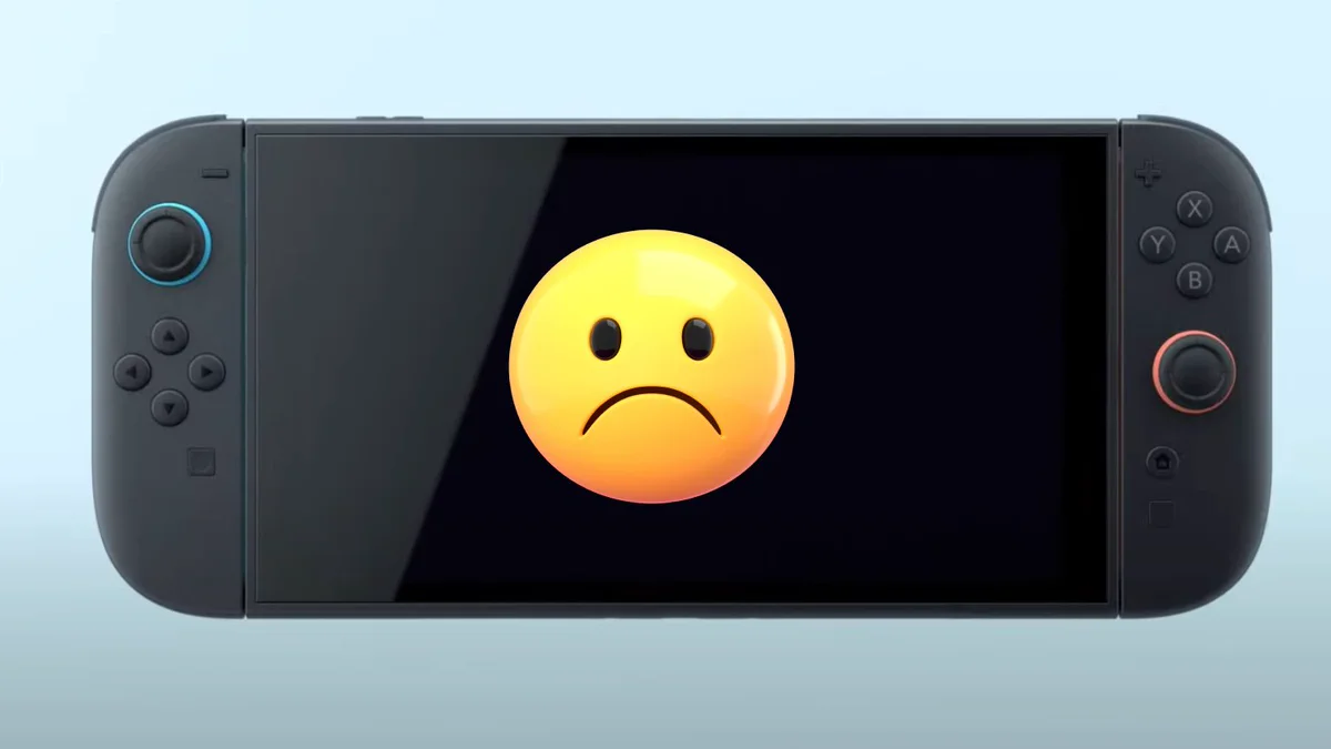 A product shot of the Switch 2 with a sad emoji face layered over the top of the screen.
