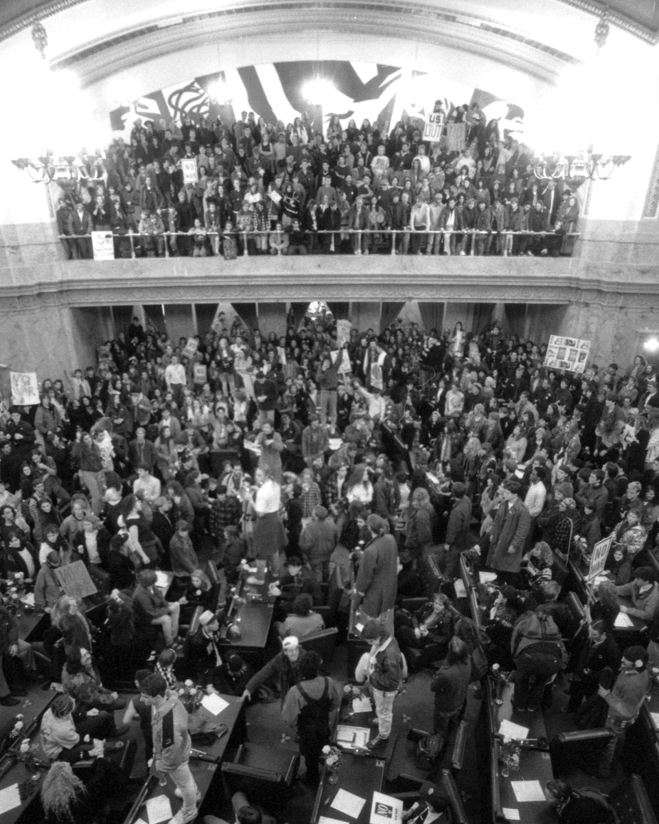 34 years ago: In the prelude to Operation Desert Storm, 1,500 anti-war protestors take over the House chamber in Olympia, flooding the floor and rostrum, vowing not to leave. 
📷 Anti-war protests, January 15, 1991. House photograph, Washington State Archives. #waleg