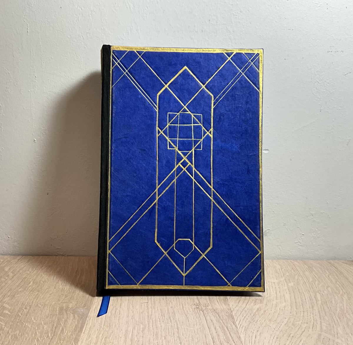 Natrishy's tweet photo. I finished my copy of @lesbianherald ’s Coming home (but not to you)!
I’m so happy how it turned out! Feels like an Arcane prop irl https://t.co/Qo0NpDWHuW