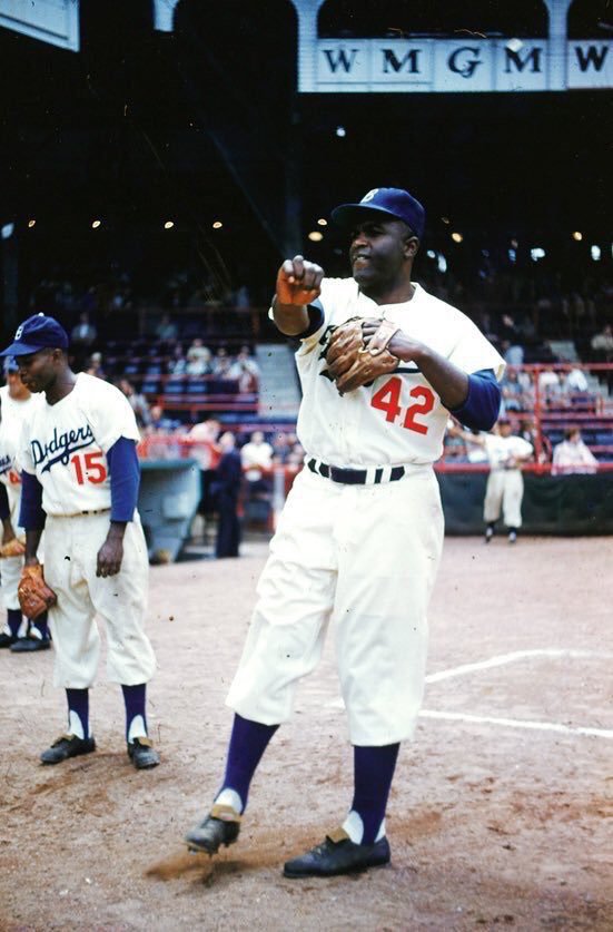Color shot of Jackie Robinson warming up at Ebbets Field, 1955. The year the Dodgers finally won it all.