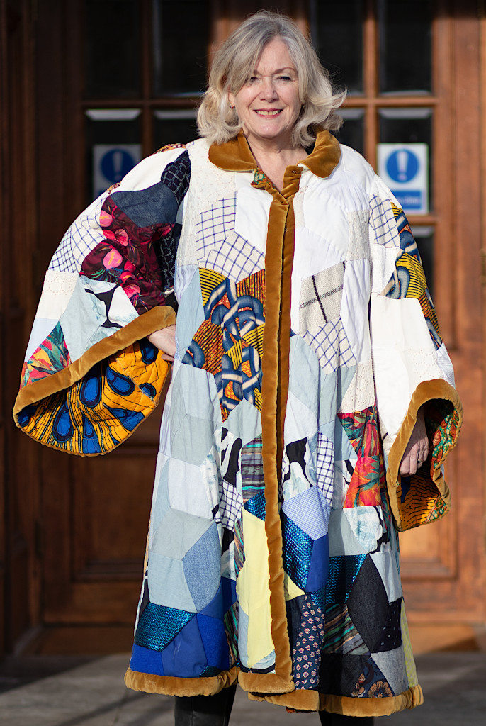 FurnerStephen's tweet photo. Haringey Mayor Sue Jameson displaying her new robes outside George Meehan House. These were designed and produced for her by the Quilt Club to be worn at the London New Years parade. The robes include historical references to the boroughs history of creativity in textile design. https://t.co/l6cyBRVp7E