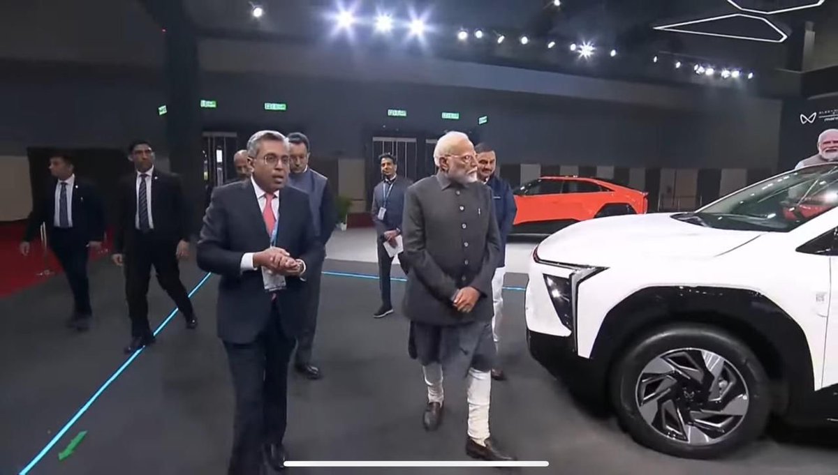 anandmahindra's tweet photo. At the Bharat Mobility Global Expo 2025 this morning. 

An honoured visitor to our @Mahindra_Auto pavilion….

Who showed particular interest in our new Electric SUVs. 

Because his eye is on the future…. https://t.co/vY5c9Wu6IX