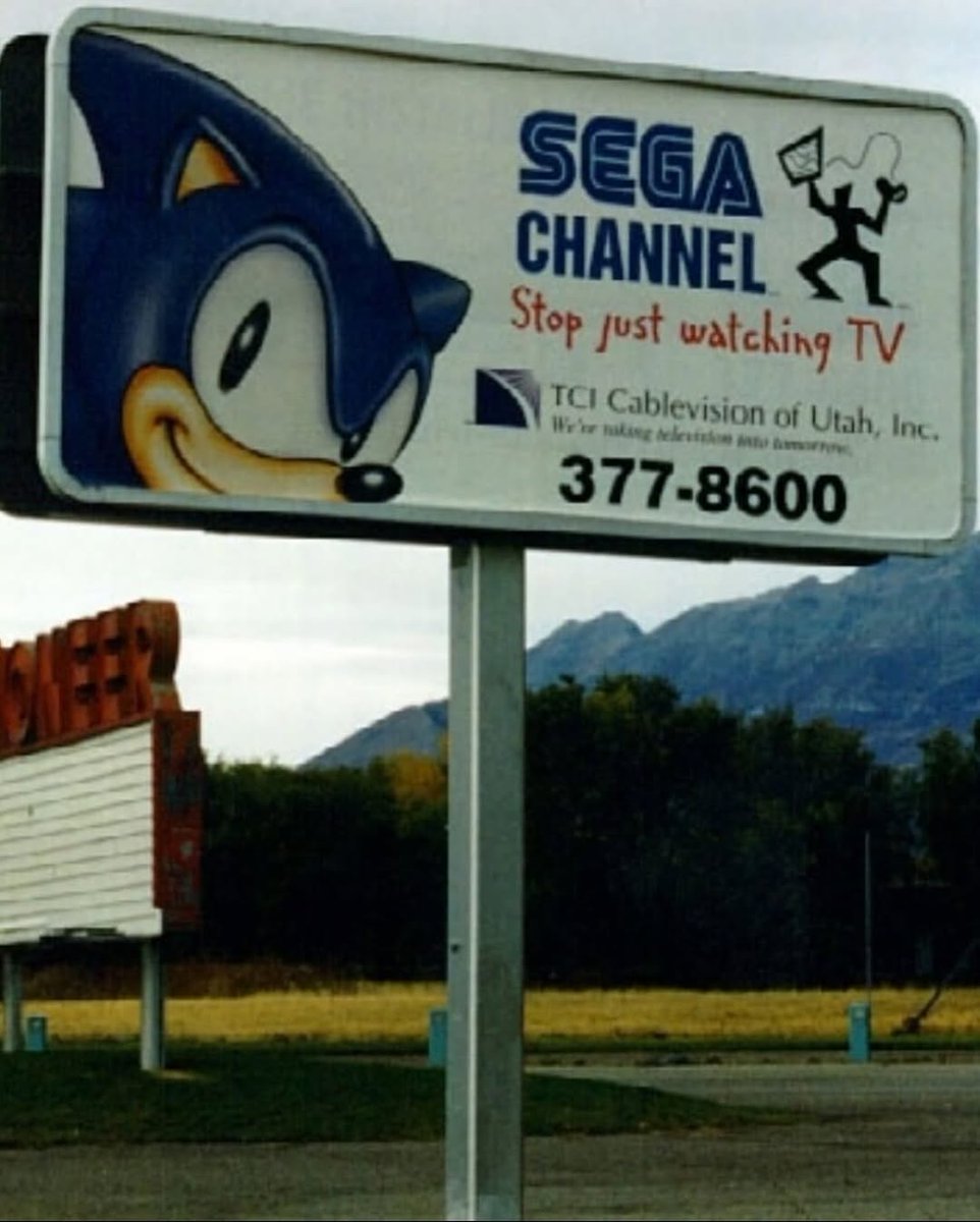 Nintendork9's tweet photo. A billboard in the 90s advertising the Sega Channel. I actually had this growing up. https://t.co/XKY7kWHUSs