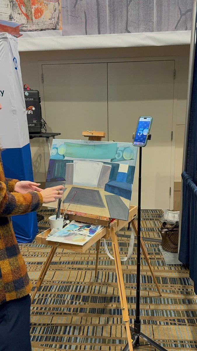 The extremely talented <a href="/giannaperani/">Gianna</a> painting a custom piece at our booth today for the <a href="/SCBAR/">South Carolina Bar</a> 🎨 Peep the #SCBar50 logo 🎉 We are raffling off a gift certificate for a custom piece of hers today so make sure to enter!