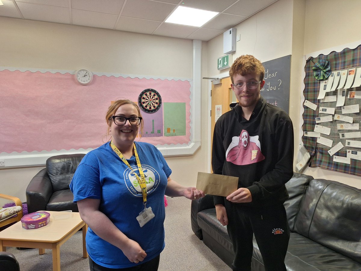NavigatePkc's tweet photo. We had a visit today from Claire, a fundraiser for @ScotAirAmb, to hand over the £200 our young people raised through running the Navigate Cafe. We heard a bit more about the work they do and how often the helicopter is called out. Jacob handed over the cash - we know it'll help! https://t.co/vGs86ZDxjz
