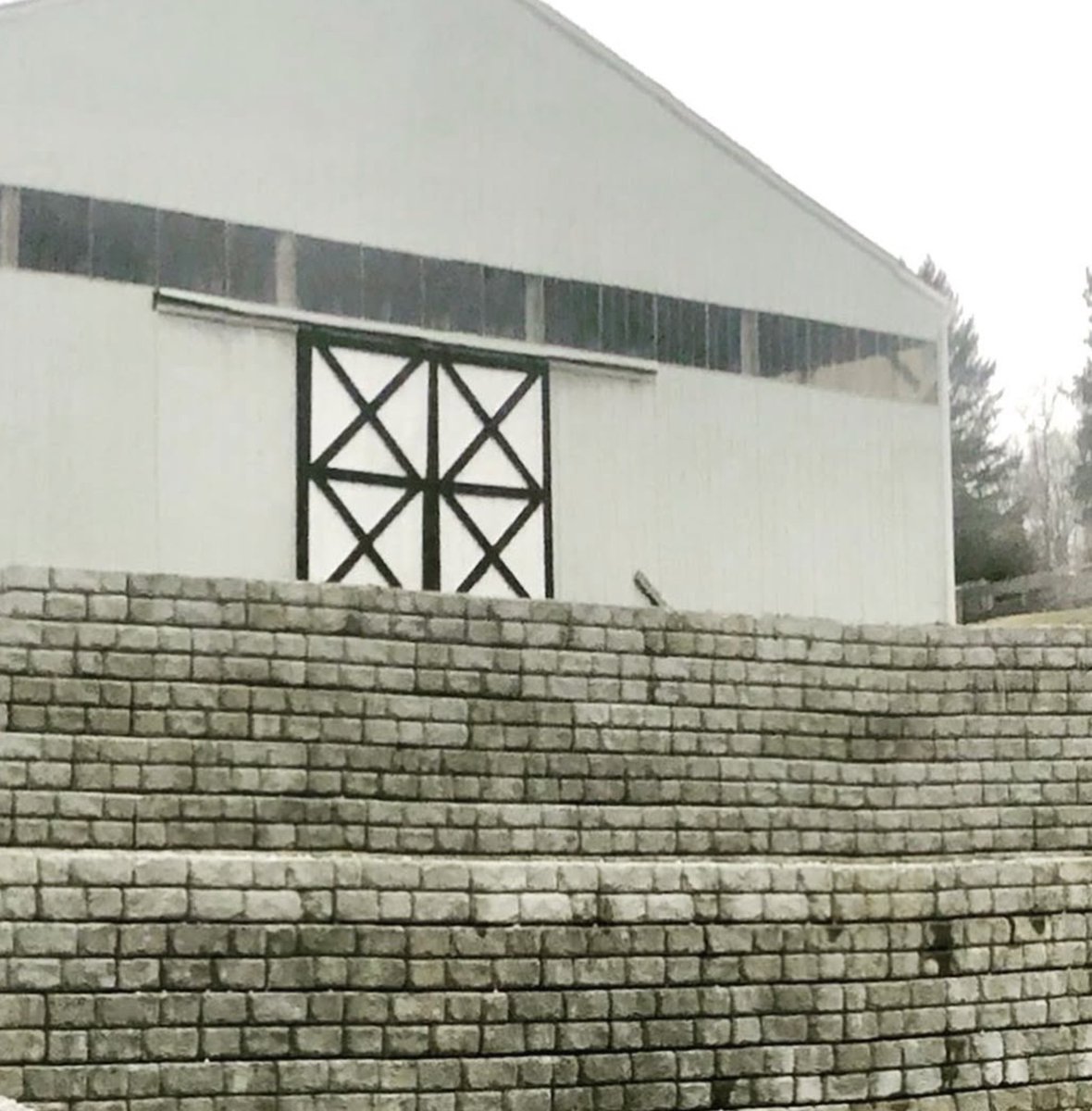 Before &amp; after! Swipe to see the result after the initial construction of a secure retaining wall for this beautiful barn.

#hudsonvalleycontractors #midhudsonconcrete #redirock