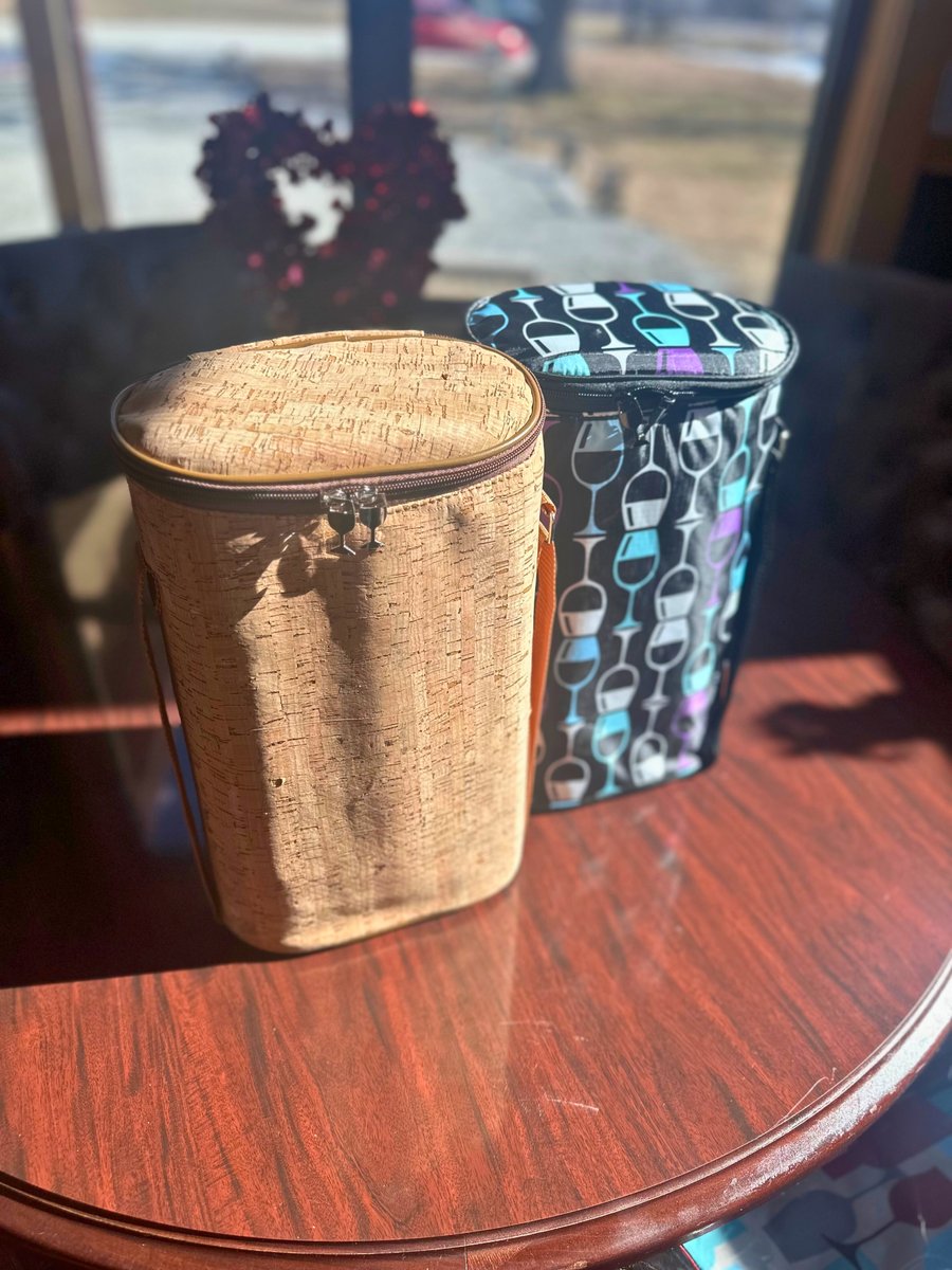 CFWinery's tweet photo. Check out these insulated wine carriers! We have several super cute patterns, and they all have a divider on the inside to safely carry two bottles of wine, along with a shoulder strap to make transporting wine even easier! We also love the wine glass detail on the zipper! https://t.co/bUIYZoWmXW