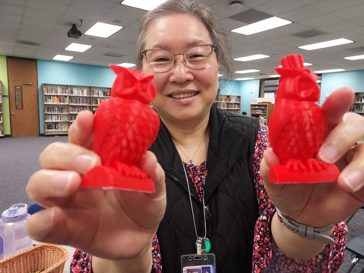 OlleLibrary's tweet photo. Our registrar, Ms.  Jacobs loves our 3-D printer.  It is always great to have staff join in on the library fun!  #MoreThanBooks #STEMLibrary @Alief_Libraries @OlleMightyOwls https://t.co/YTuqIM69et