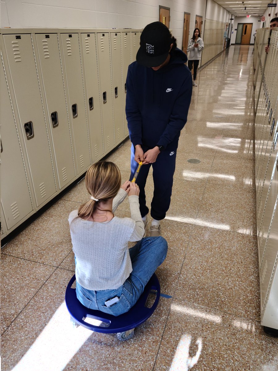 RFH_STEM's tweet image. Mr. Langford's Physics students putting Newton's Laws of Motion...INTO motion, scootering down the hallway in the name of Science! @RFH_Regional