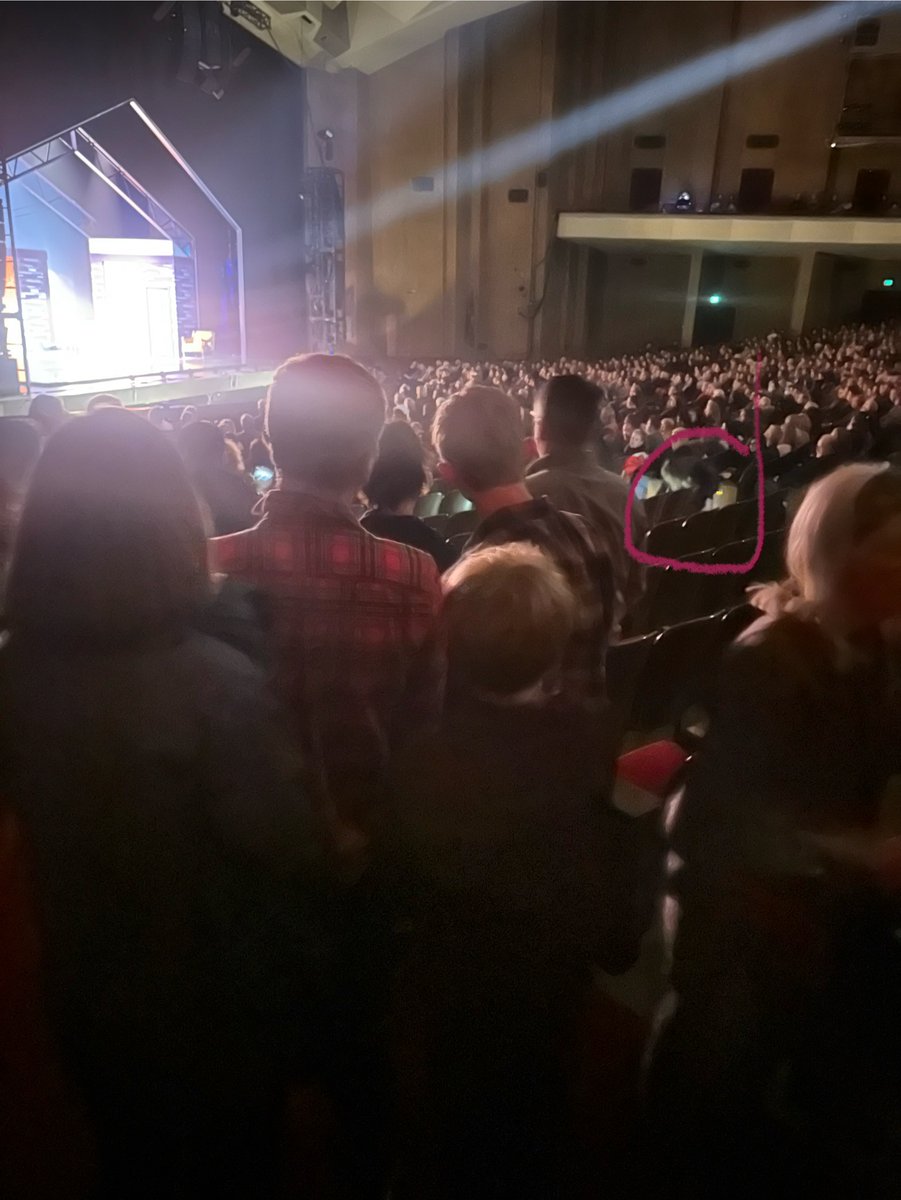 peterjnyc's tweet photo. @Oil20Xx ...immediately alerted the man sitting there. About 20 of us moved to the side by the exit. Weirdly the show continued! Went to lobby &amp; while there we heard them pause the show &amp; shortly after they evacuated the theater. Pic I took; I think you can see staff looking at the cable. https://t.co/7oKcwiWhFm