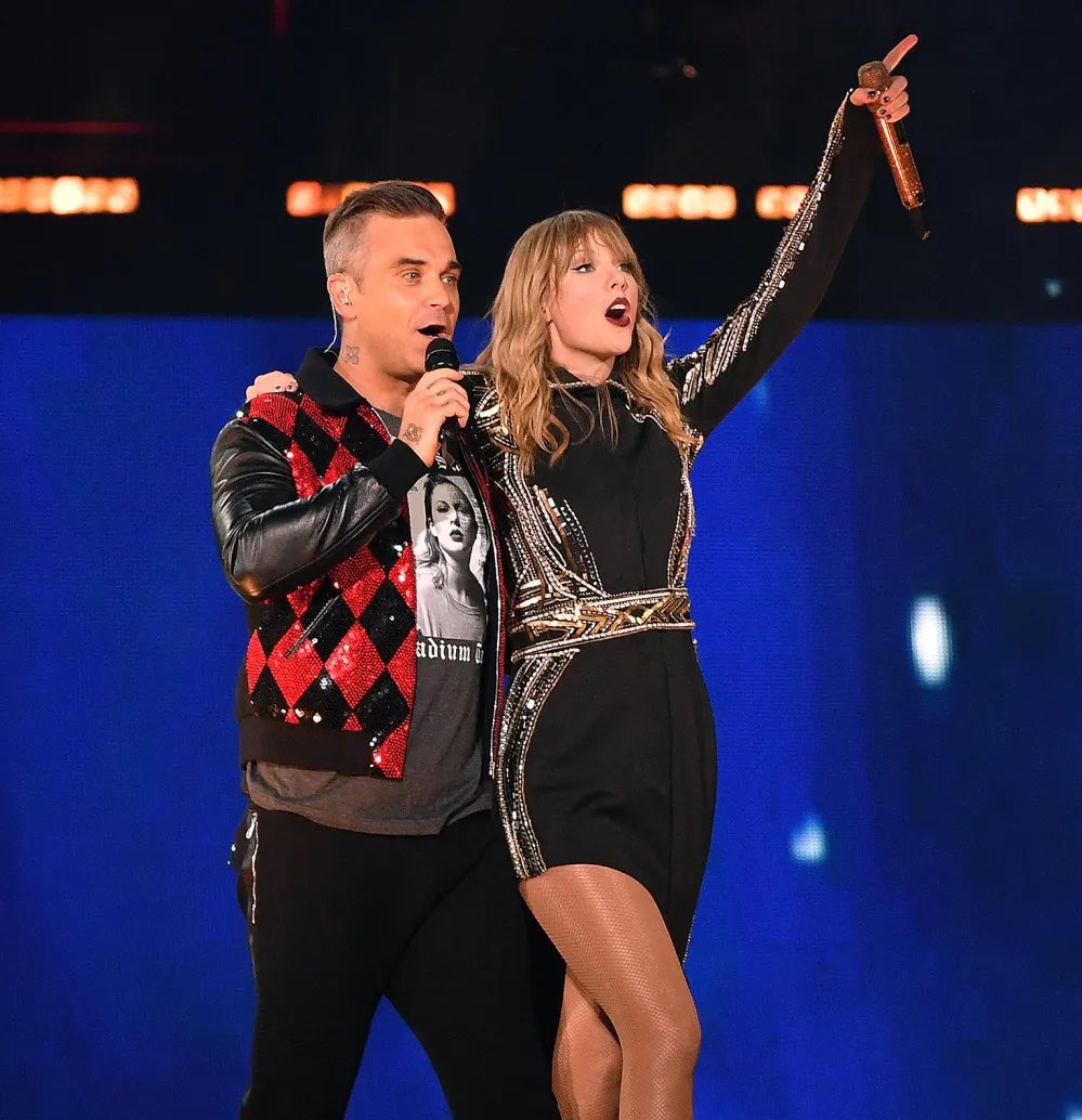 PopBase's tweet photo. Robbie Williams says he believes Taylor Swift was unaware of how famous he is in London when he was a surprise guest at her ‘reputation’ tour:

“I think maybe whoever she was dating at the time was English and went, ‘Hey maybe you should get Robbie Williams.’” https://t.co/Vodz0htxOS