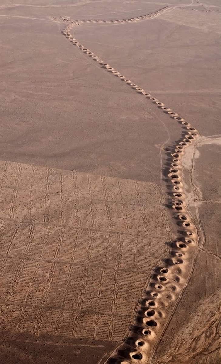 archeohistories's tweet photo. Qasabeh (Ghasabe) Qanat; an underground aqueduct in the city of Gonabad, Razavi Khorasan Province, Iran. It is one of oldest and largest qanats in the world built between 700-500 BC.

It is one of the oldest water supply system, that was made around 3000 years ago. These holes are called Qanat; an ancient Persian system of water supply. There was an underground canal that people used to drink water from or would get water for their plants.

There are scary myths and stories that have long circulated among local people. The ancient people believed that this qanat could not be constructed by humans and was made by super-human forces. Most of what we know about this underground aqueduct are the legends that the people of Gonabad have been narrating since the past.

Traditionally qanats were built by a group of skilled laborers, with hand labor. According to most sources, the qanat technology was developed in ancient Iran by the Persian people sometime in the early 1st Millennium BC, and spread from there slowly westward and eastward.

Apart from mythical and historical stories about the qanat, archaeological investigations into the aqueduct led to the discovery of pottery collected from the main wells proving that this strange aqueduct dates back to the Achaemenid Dynasty (550-330 BC). 

French researcher Henri Goblot, in a book called “Qanats: A Water Acquisition Technique”, describes the underground aqueduct as an oddity and, of course, a structure built using the techniques of engineering. In his view, this qanat, which is the most original one in the world, is made by people who have had superhuman powers. To find pure water in an arid landscape and create lush vistas in middle of nowhere, they found an effective solution to Iran’s dearth of easily accessible water in marvel of ancient Iranian engineering known as kariz, more popularly known by its Arabic name, the qanat.

He travelled to Iran in 1940 to do research and comment on modern irrigation methods. In his book, he attributes the culmination of creativity to the builders and engineers of Gonabad qanat. This weird qanat is an ancient one dating back to 2500 to 2700 years ago.

Gonabad qanat also has two underground corridors that are 33km long as well as very deep wells, some of them 300m deep. The qanat was first added to UNESCO’s list of tentative World Heritage Sites in 2007, then officially inscribed in 2016, collectively with several other qanats, as “The Persian Qanat”.

A qanat or kariz is a gently sloping underground channel to transport water from an aquifer or water well to surface for irrigation and drinking, acting as an underground aqueduct. This is an old system of water supply from a deep well with a series of vertical access shafts.

This ancient water tunnel became a UNESCO World Heritage Site. It contains 427 water wells with a total length of 33,113m. Gonabad’s qanat still create a reliable supply of water for human settlements and irrigation in hot, arid, and semi-arid climates, and provides fresh water to more than 40,000 people, but the value of this system is directly related to the quality, volume, and regularity of the water flow.

#archaeohistories