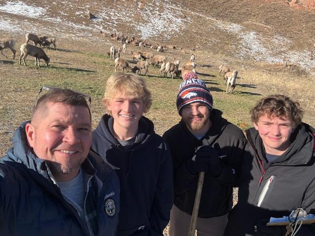 CPW_SE's tweet photo. Every recent morning, @COParksWildlife staff &amp; volunteers in #ColoradoSprings spread apple pulp &amp; alfalfa to prep the Rampart bighorn sheep herd for a capture operation to start a new herd. Senior aquatic bio Paul Foutz &amp; sons Parker, Jack &amp; Connor, did the honors last week. https://t.co/fjDI82E2Eo
