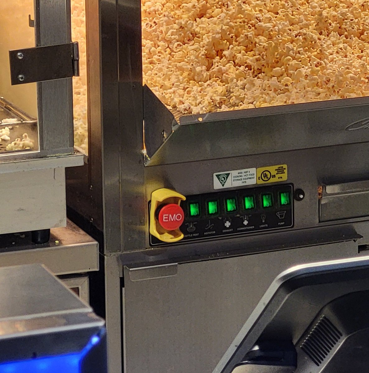 Sad7Statue's tweet photo. Why does the popcorn machine have a big red EMO button? Like is it for emergency Hawthorne Heights? https://t.co/65nOyulcx8