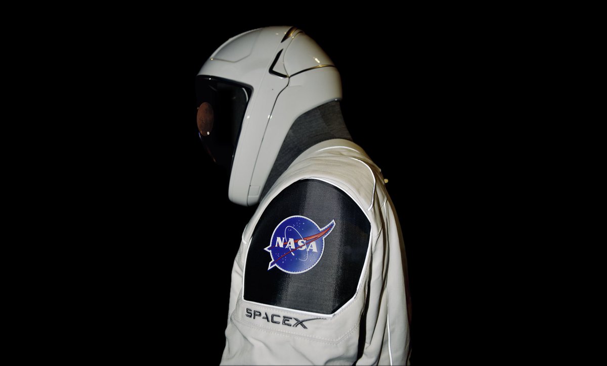 scimediapro's tweet photo. Here are some photographs I took of the @SpaceX astronaut 🧑‍🚀 suit. 

The SpaceX space suit has become iconic for its sleek, futuristic design. 

Initially introduced for the Crew Dragon spacecraft, it marks a significant shift from traditional NASA spacesuits, focusing on both aesthetics and functionality. 

Astronauts can put on the suit independently in less than 10 minutes, a significant improvement over previous models that required assistance.

SpaceX developed an Extravehicular Activity (EVA) version of the suit for the Polaris Dawn mission, enhancing mobility and adding features like a heads-up display (HUD) and camera for monitoring suit metrics.

Key components like the helmet are 3D-printed using advanced polymers. This allows for precise customization and material use.

The outer layer of the suit uses materials like Nomex, Kevlar, and Teflon, which offer resistance to heat, abrasion, and environmental hazards.