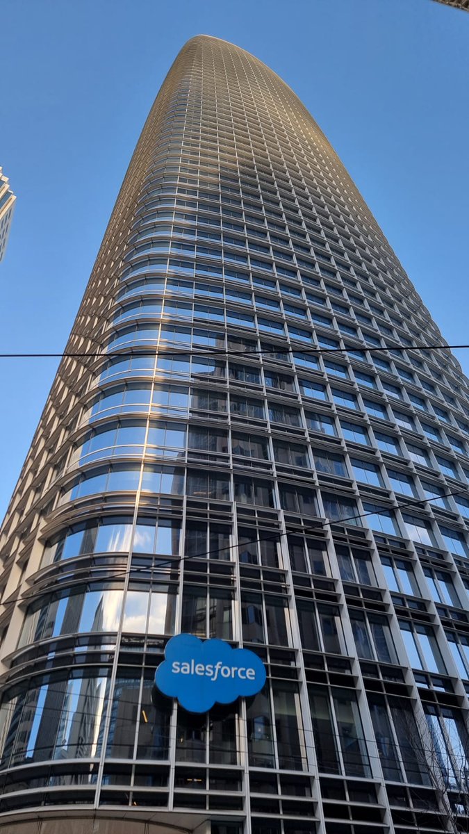 amerour's tweet photo. This is the Salesforce Tower in San Francisco, and it’s absolutely gigantic.

With 61 floors and standing 326 meters tall, it’s one of the most iconic features of SF’s skyline—and the tallest building in the city.

Fun fact: it’s also the final work of renowned architect César Pelli to be completed in his lifetime.

As I was looking up at it, I was thinking "In a post-COVID world, how much of that space is actually being used?"

Remote work is here to stay and AI will make companies smaller ... so what's the future for buildings like this? 🤔