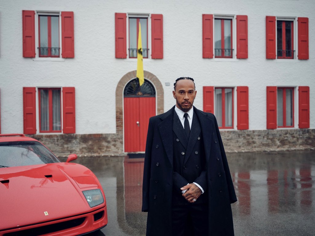 tsimiks's tweet image. The Italian tailored suit, the trench coat, an F40 by his side, and the iconic house as the backdrop.

A picture can’t get more iconic and historical than the first shot of Sir Lewis Hamilton as a Ferrari driver, one for the history books.