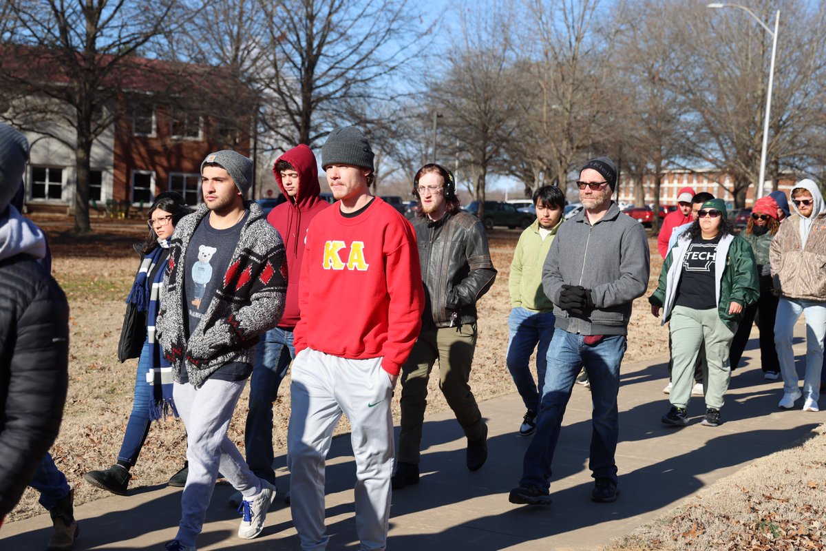 ArkansasTech's tweet photo. Despite temperatures in the low 20s, dozens of Arkansas Tech University students, faculty and staff participated in a silent march celebrating the life and legacy of Dr. Martin Luther King Jr. on Monday morning. #arnews https://t.co/NpT87W0DLd