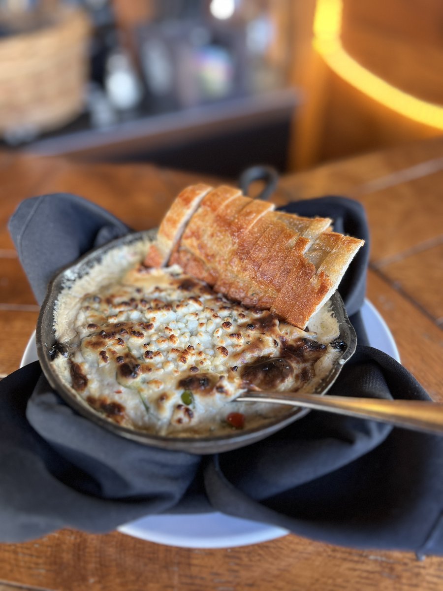 This Cheese Lovers Day, give them what they really want...roasted garlic, bleu cheese, goat cheese, cream cheese, sweet red and green peppers, baby spinach, served with French bread. #bourbonsbistro #cheeseloversday