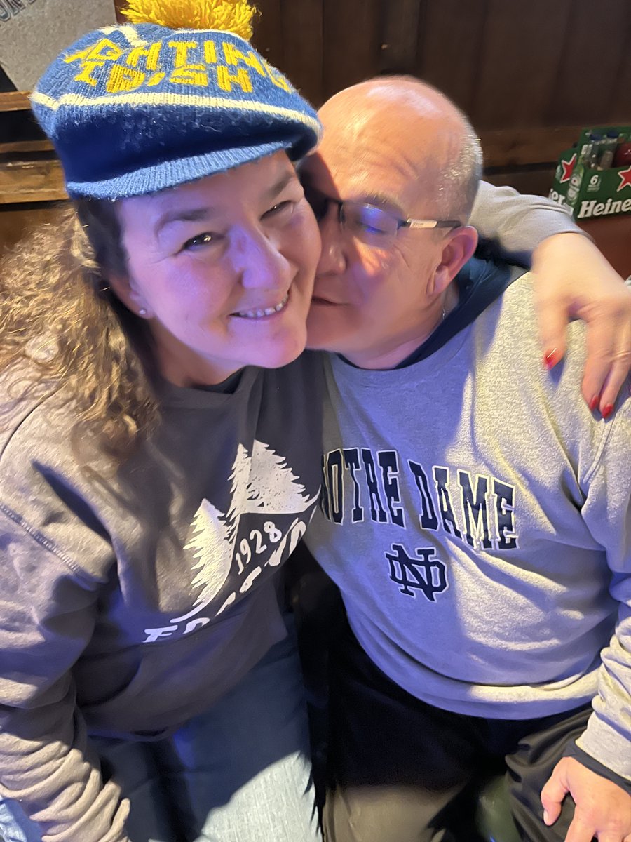WorldBowlReport's tweet photo. Anne McLaughlin with her 1971 ND Cap celebrates Notre Dames only first down of the first half with fellow Irish Fan Dan Sheehan.  Dan allowed the Gang to take over Sheehan's on the Green Monday Night. https://t.co/RQD2HLrRig