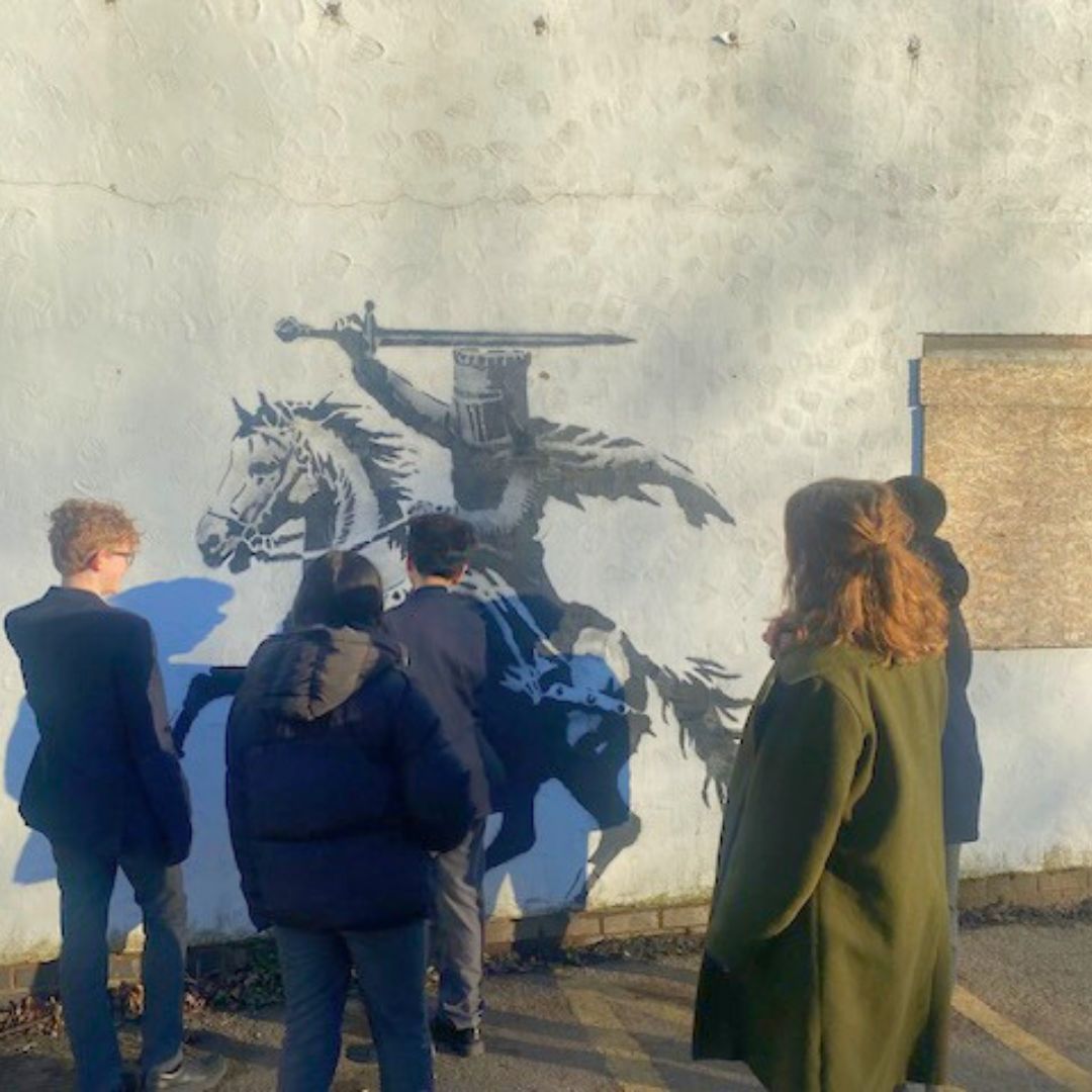 Last Thursday, a group of our Year 8 art students ventured out to Ruthin town centre to view the Banksy-style artwork that had appeared overnight. 

The mysterious pieces sparked a lively conversation about the role of public art and the use of social messages.