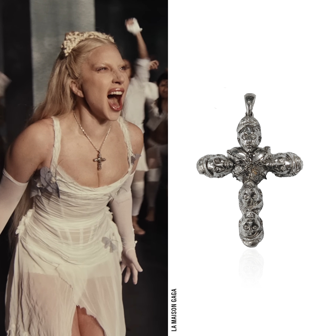 LaMaisonGaga_'s tweet photo. She's SO back! A little hidden detail from the "Abracadabra" video is her custom #DOSISG6C cross necklace, which is made of mini Oscars 2019 Gagas! https://t.co/fVZ4qMhrQs