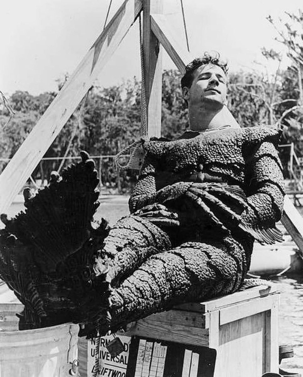 HorrorHammer1's tweet photo. Great behind the scenes photo 
Creature from the Nap Lagoon! The late, great Ricou Browning catches a quick snooze on the set of “Revenge of Creature. 1955 https://t.co/Y4AnvQLR9z